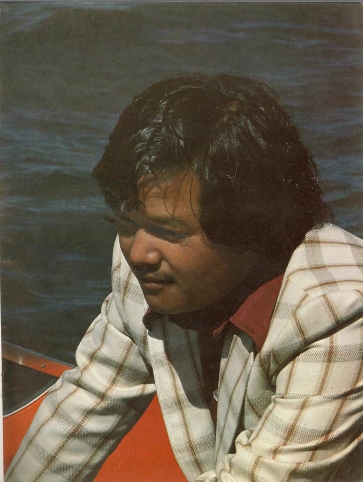 Prem Rawat (Maharaji) In a Loud Coat In A Speed Boat