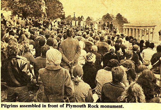 Pilgrims assembled in front of Plymouth Rock monument.