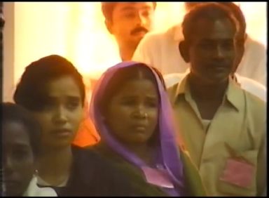 A line of people kissing Prem Rawat's feet